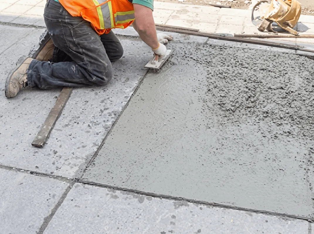Professional repairing a concrete floor in Gilbert, AZ